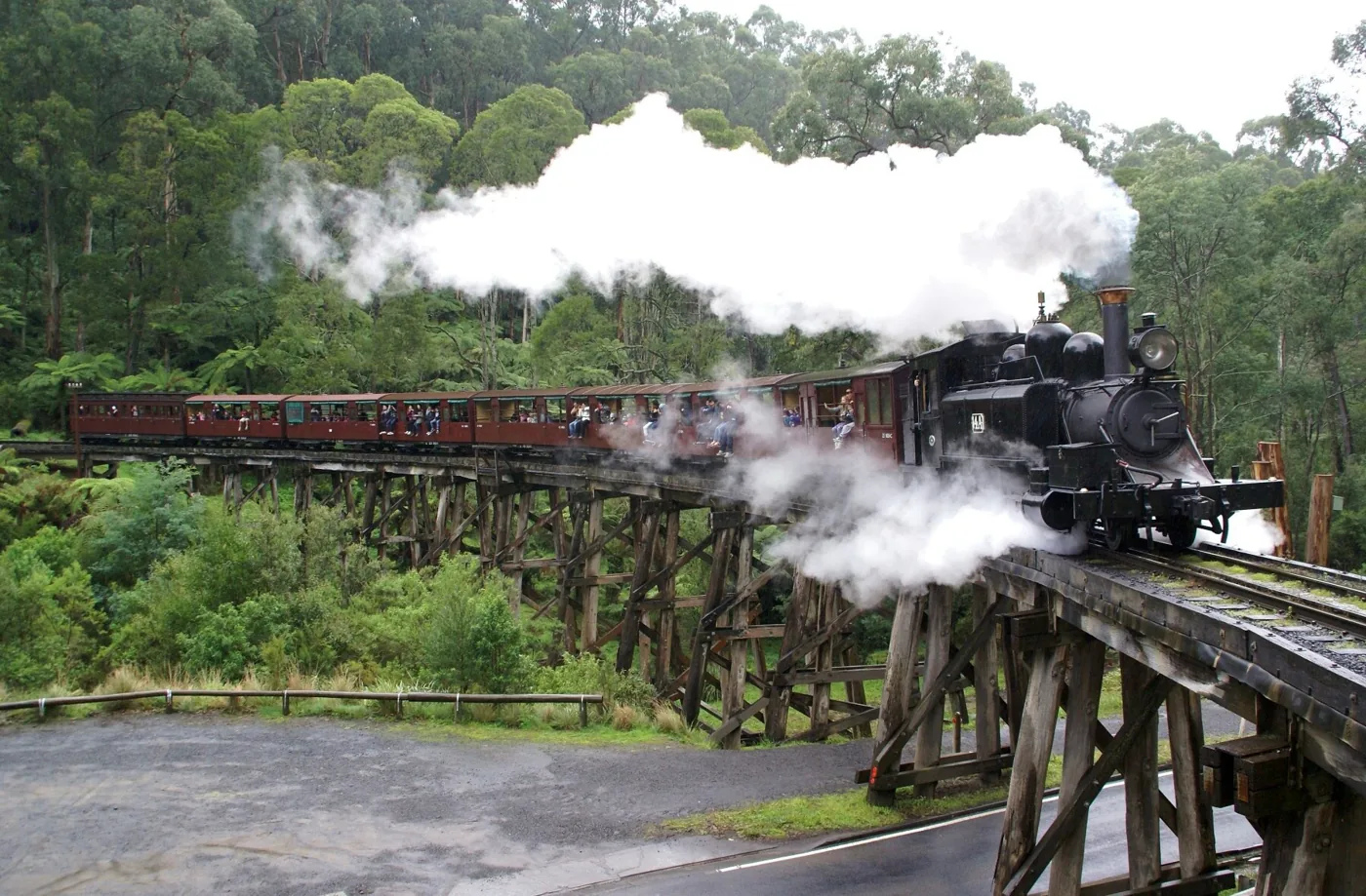Puffing Billy steam train crossing Monbulk Creek trestle bridge