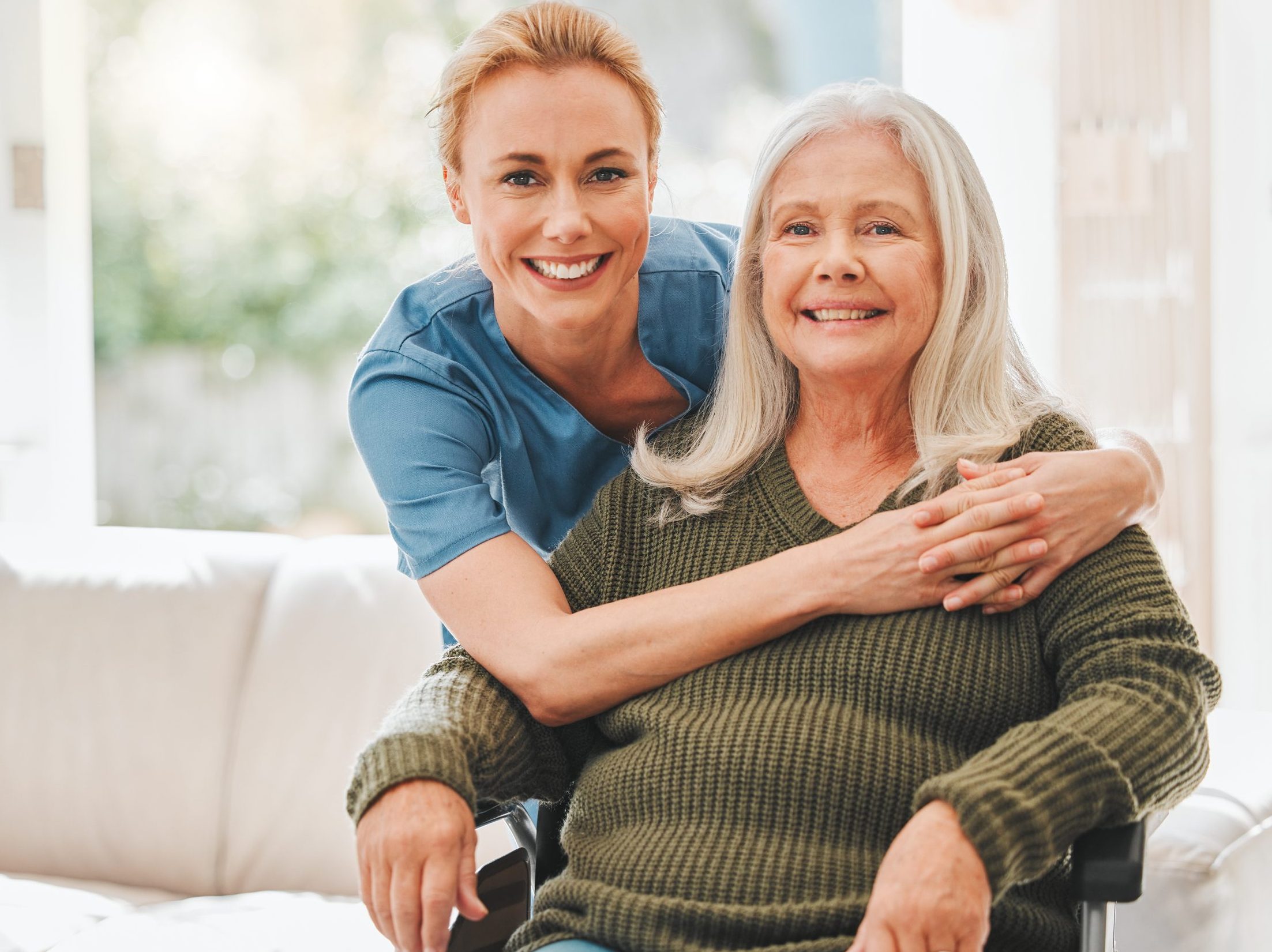 Shot of a female nurse hugging her mature patient.